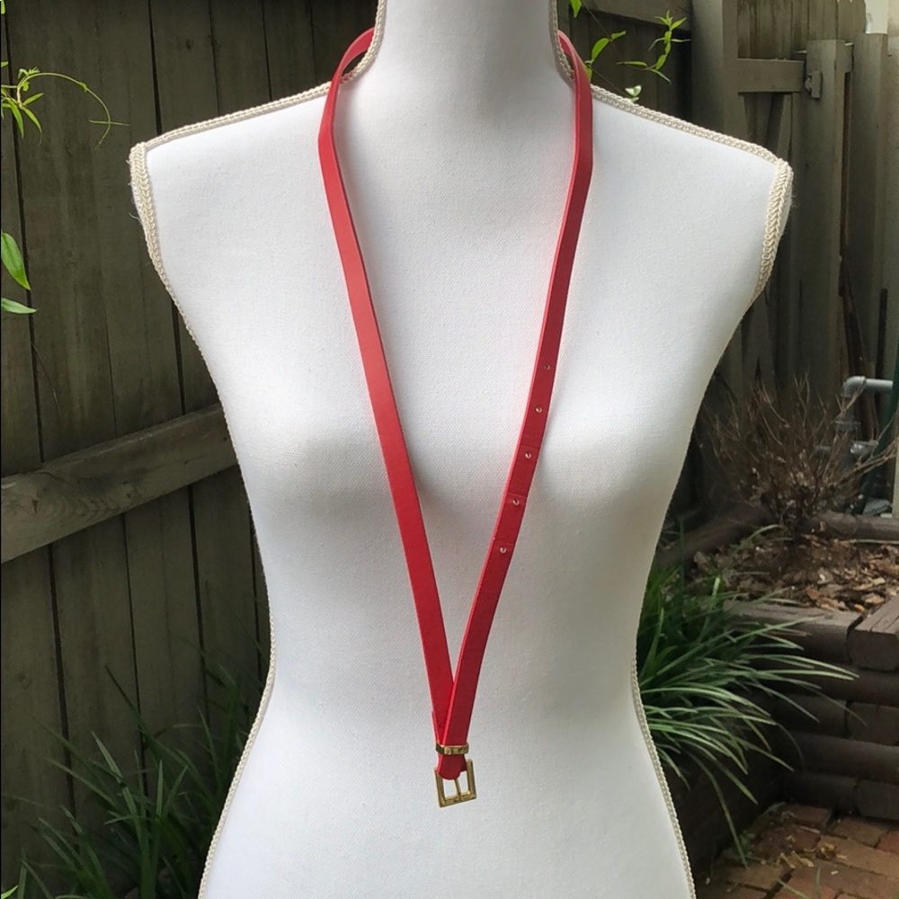 Thin pink belt with gold tone hardware